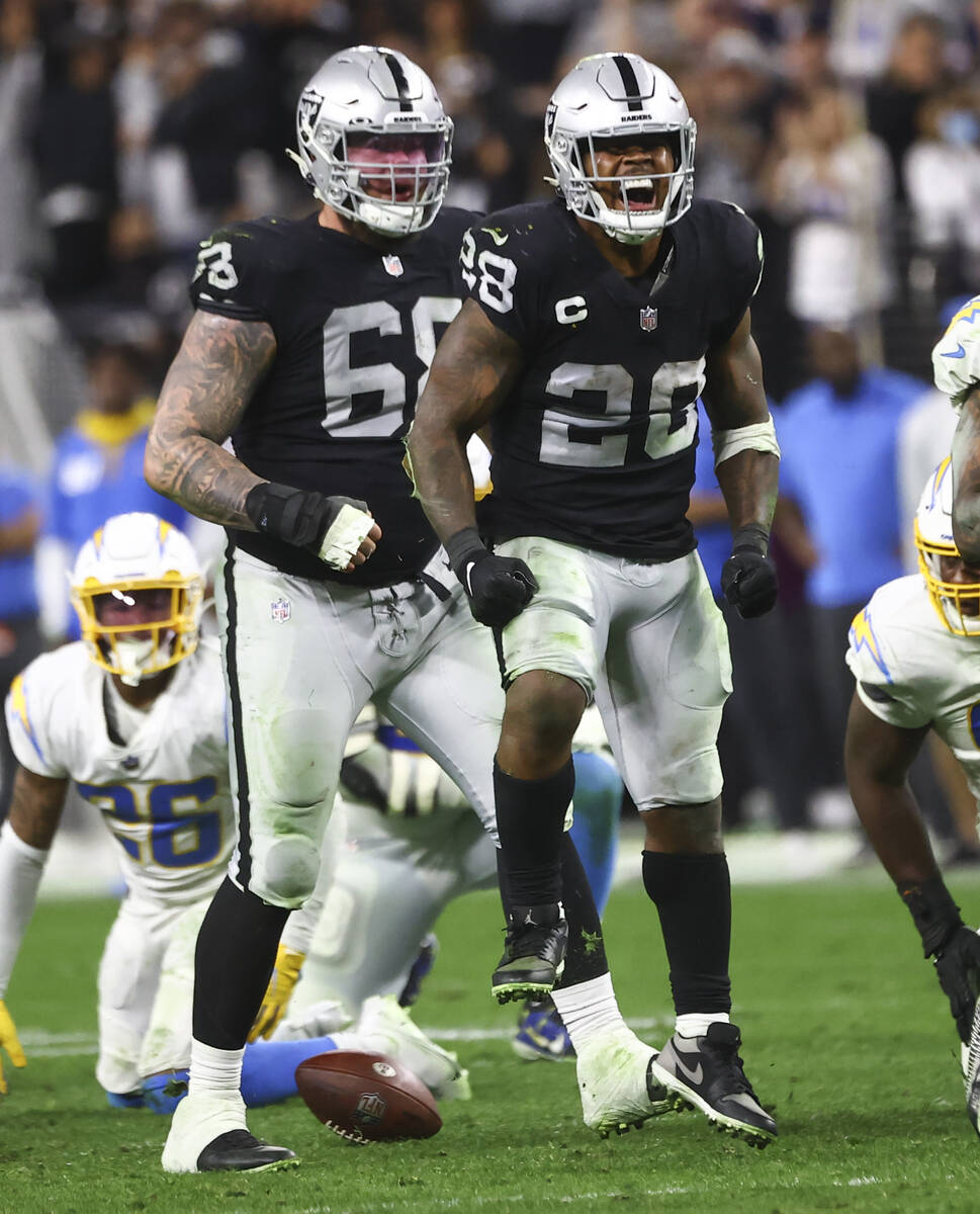 Raiders running back Josh Jacobs (28) celebrates after a play against the Los Angeles Chargers ...