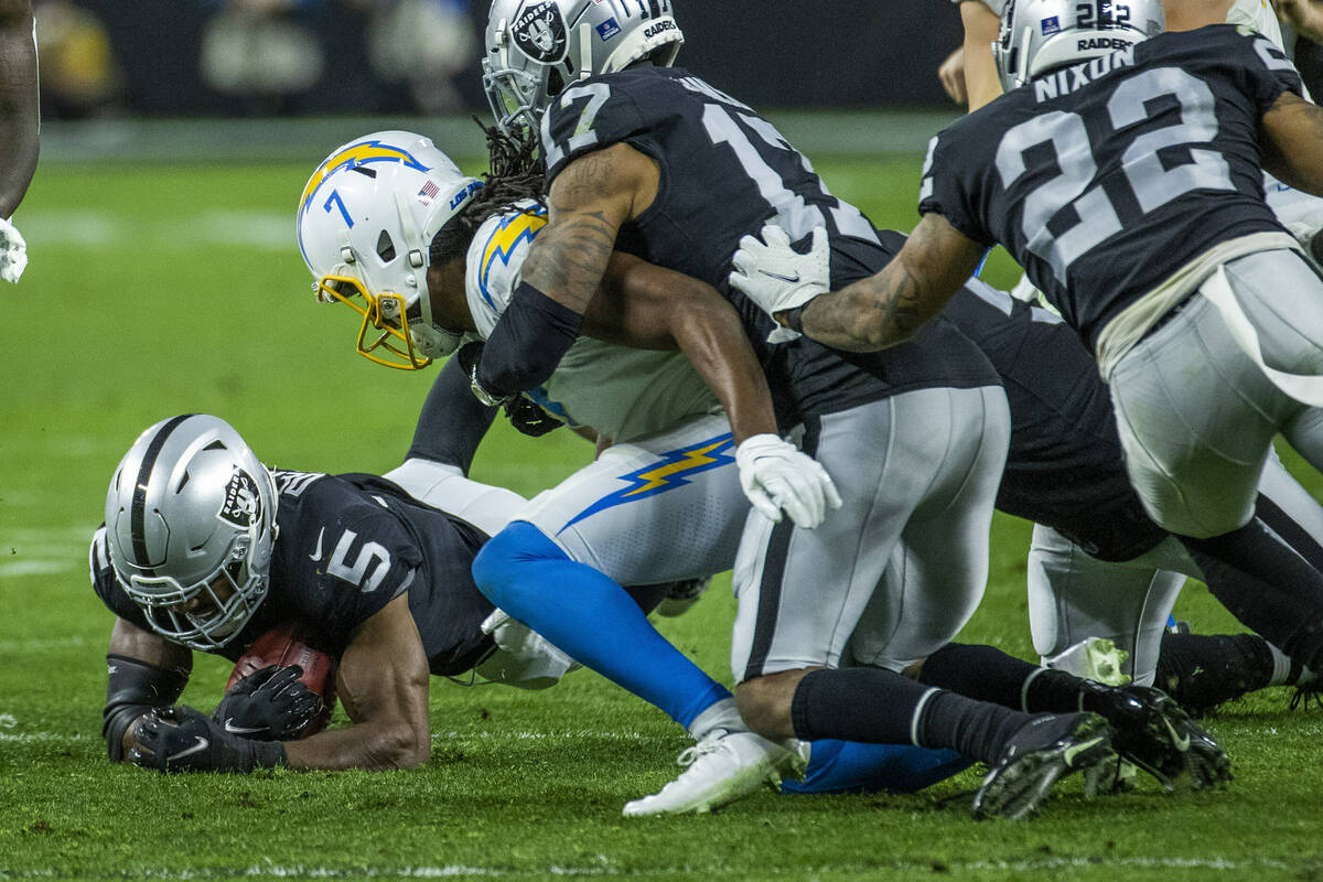 Raiders linebacker Divine Deablo (5) recovers a fumble from the Los Angeles Chargers during the ...