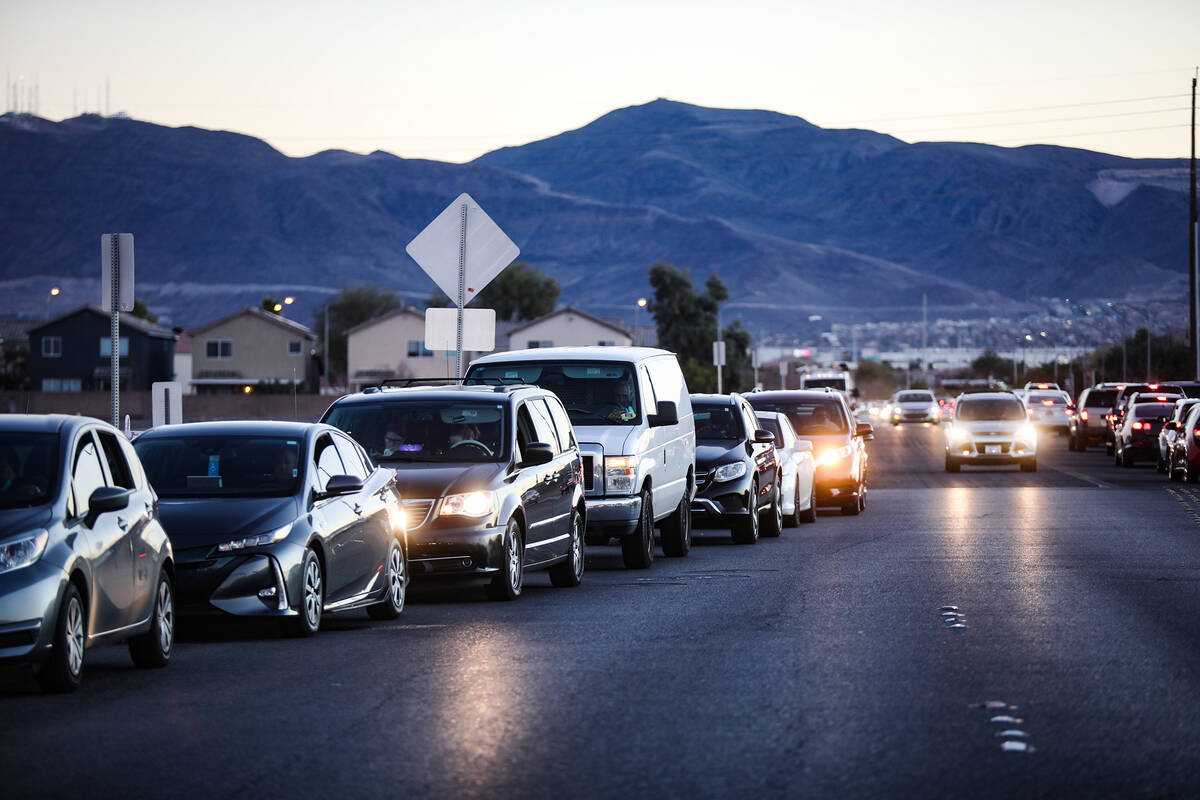 People wait in line for the COVID-19 testing and vaccine clinic at Sam Boyd Stadium on Sunday, ...