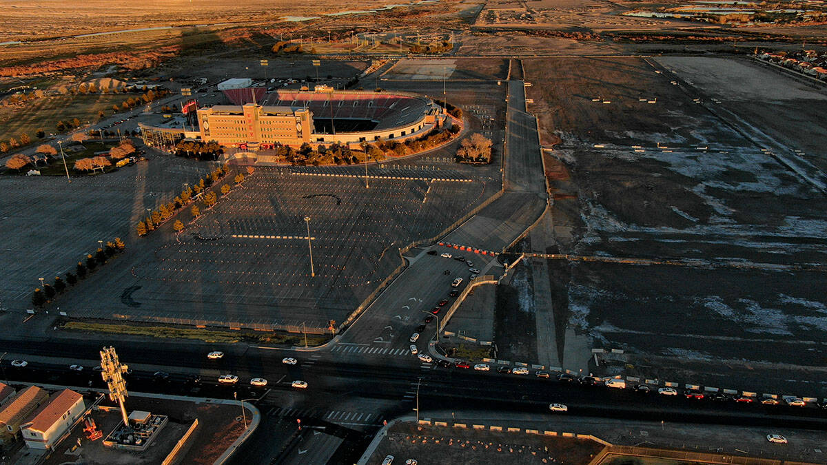 An aerial view of Sam Boyd Stadium as cars line up down South Broadbent Boulevard for the drive ...