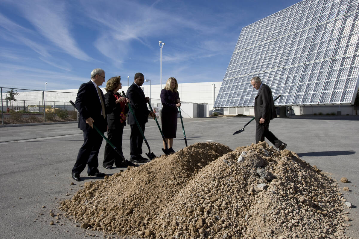 In this Oct. 28, 2010, file photo, Harry Reid, right, walks to participate in a ceremonial grou ...