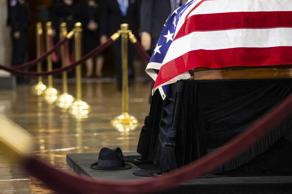 A hat worn by former Sen. Harry Reid is seen at the base of the Lincoln catafalque as Reid lies ...