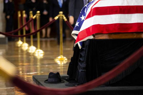 A hat worn by former Sen. Harry Reid is seen at the base of the Lincoln catafalque as Reid lies ...