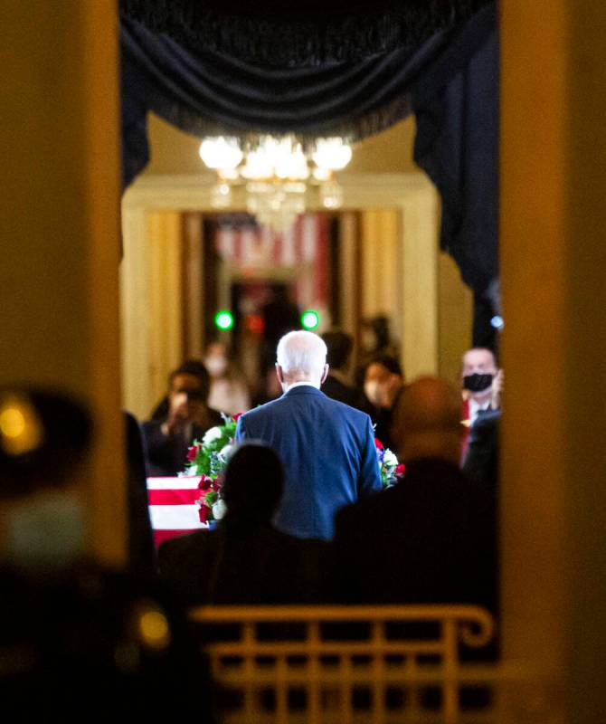 President Joe Biden enters the Rotunda to pay respects to former U.S. Sen. Harry Reid as he li ...