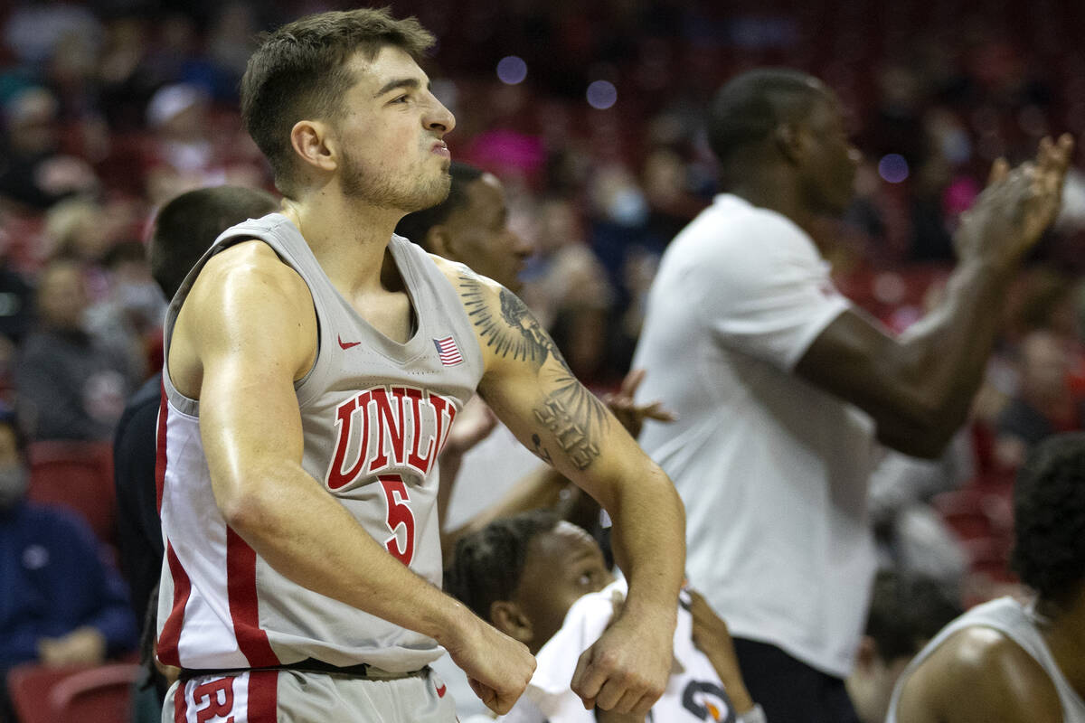 UNLV Rebels guard Jordan McCabe (5) reacts to his team scoring against the New Mexico Lobos dur ...