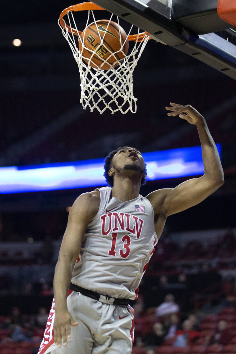 UNLV Rebels guard Bryce Hamilton (13) scores against the New Mexico Lobos during the second hal ...