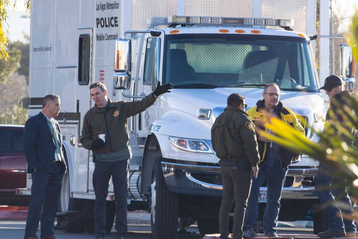 The Las Vegas police officers are congregating in the parking lot of a post office at Nellis Bo ...