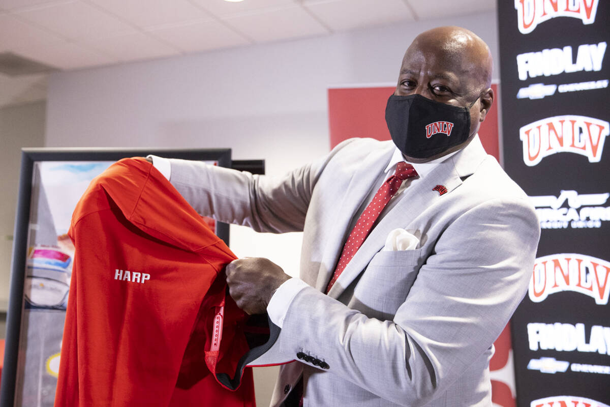 Erick Harper shows his custom gear he received following a press conference announcing him as t ...