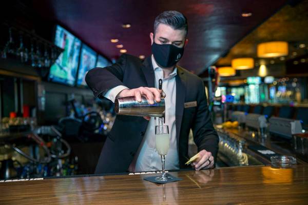 Director of Beverage Sam Pulliam pours a vintage cocktail ғage and the PineӠas the ...