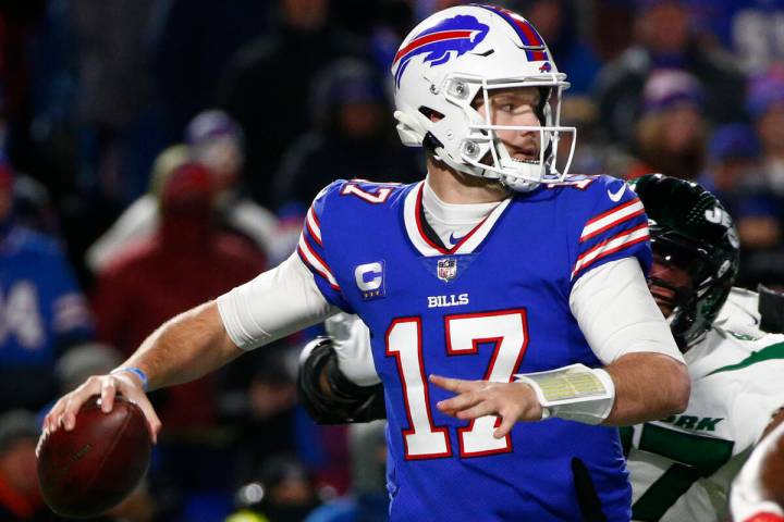 Buffalo Bills quarterback Josh Allen (17) throws a pass during the second half of an NFL footba ...