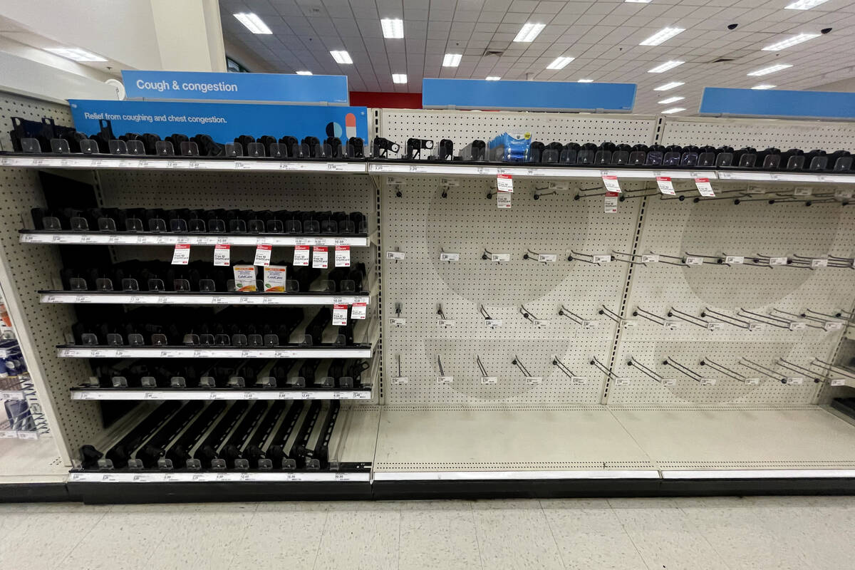 Empty cold and cough medicine shelves are seen at Target, 3210 N Tenaya Way, in Las Vegas, Thur ...