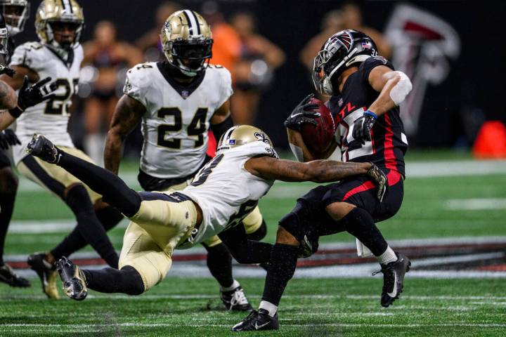 New Orleans Saints defensive back J.T. Gray (48) tackles Atlanta Falcons cornerback Avery Willi ...