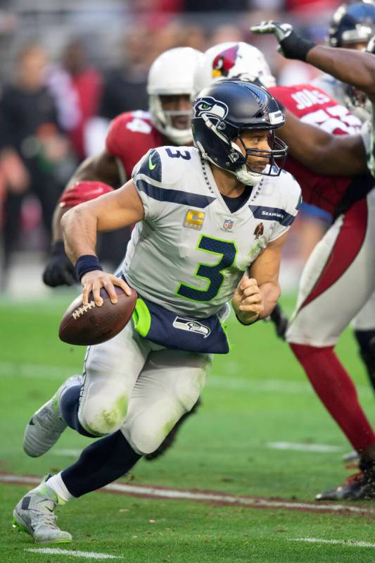 Seattle Seahawks quarterback Russell Wilson (3) scrambles against the Arizona Cardinals during ...