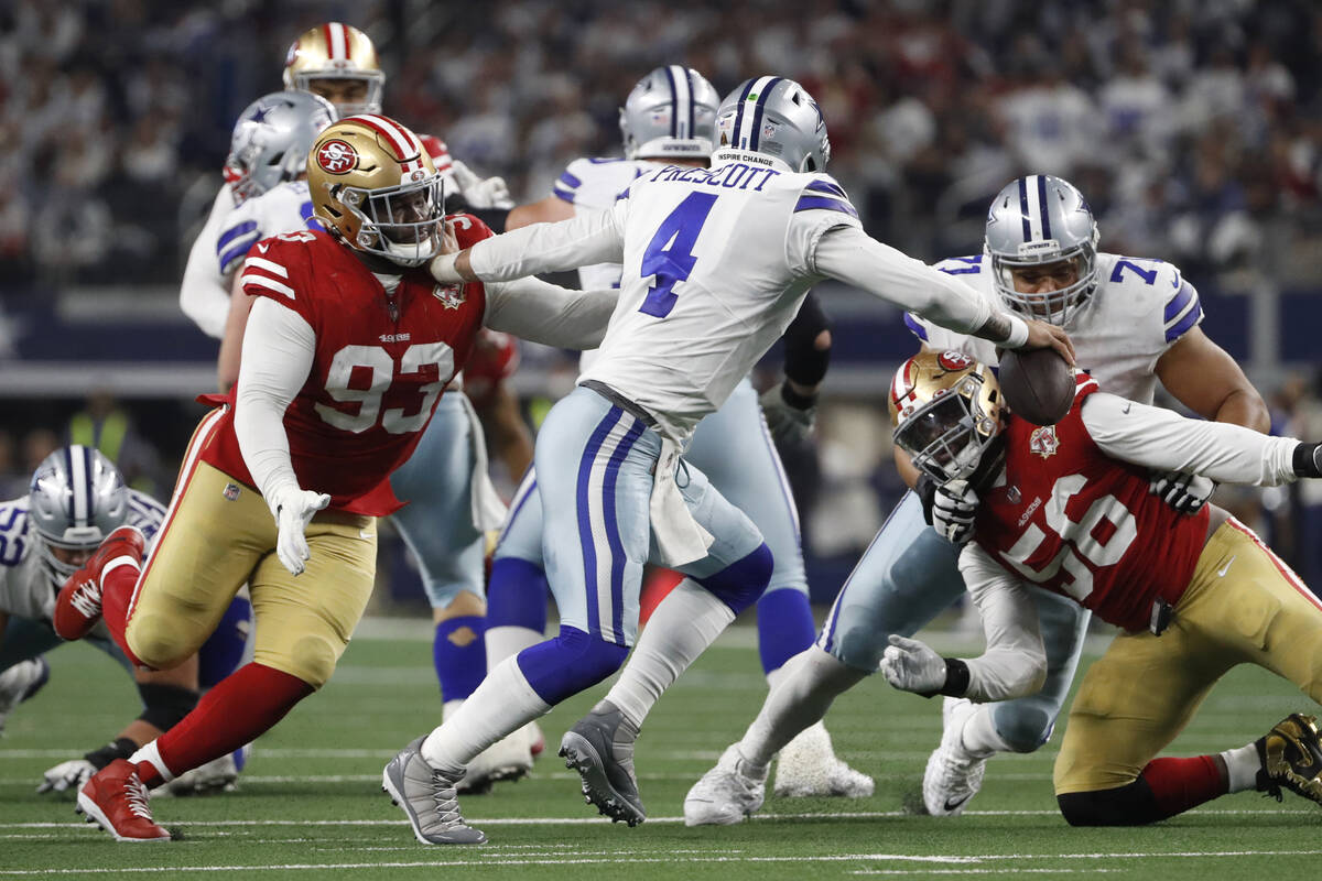 San Francisco 49ers defensive tackle D.J. Jones (93) sacks Dallas Cowboys quarterback Dak Presc ...