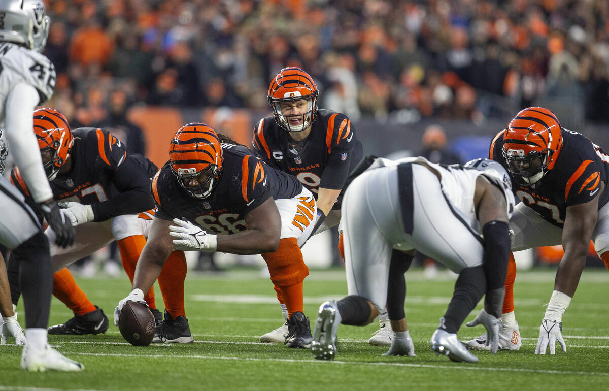 Cincinnati Bengals quarterback Joe Burrow (9) calls for the snap behind the line of scrimmage d ...