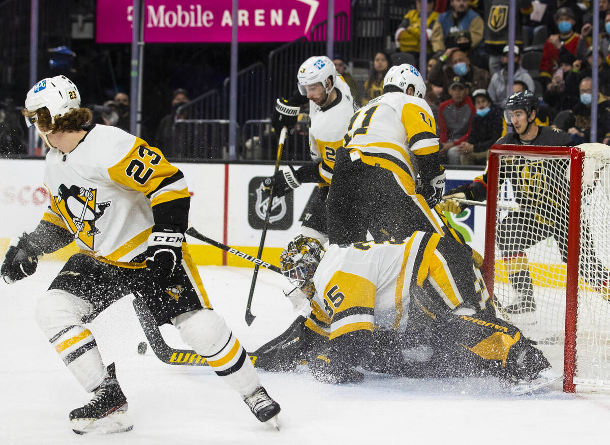 Pittsburgh Penguins goaltender Tristan Jarry (35) makes a save in the first period during an NH ...