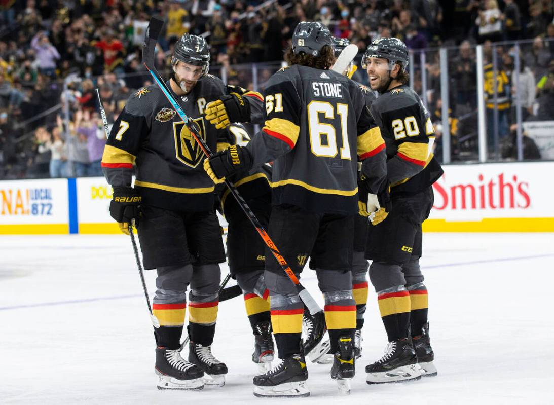 The Golden Knights celebrate a first period goal by right wing Evgenii Dadonov (63) during an N ...