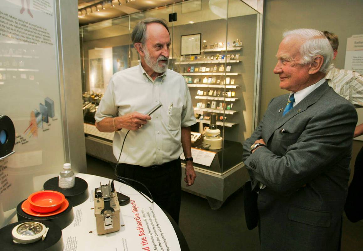 Former Apollo 11 astronaut Edwin E. "Buzz" Aldrin listens as Troy Wade, president of ...