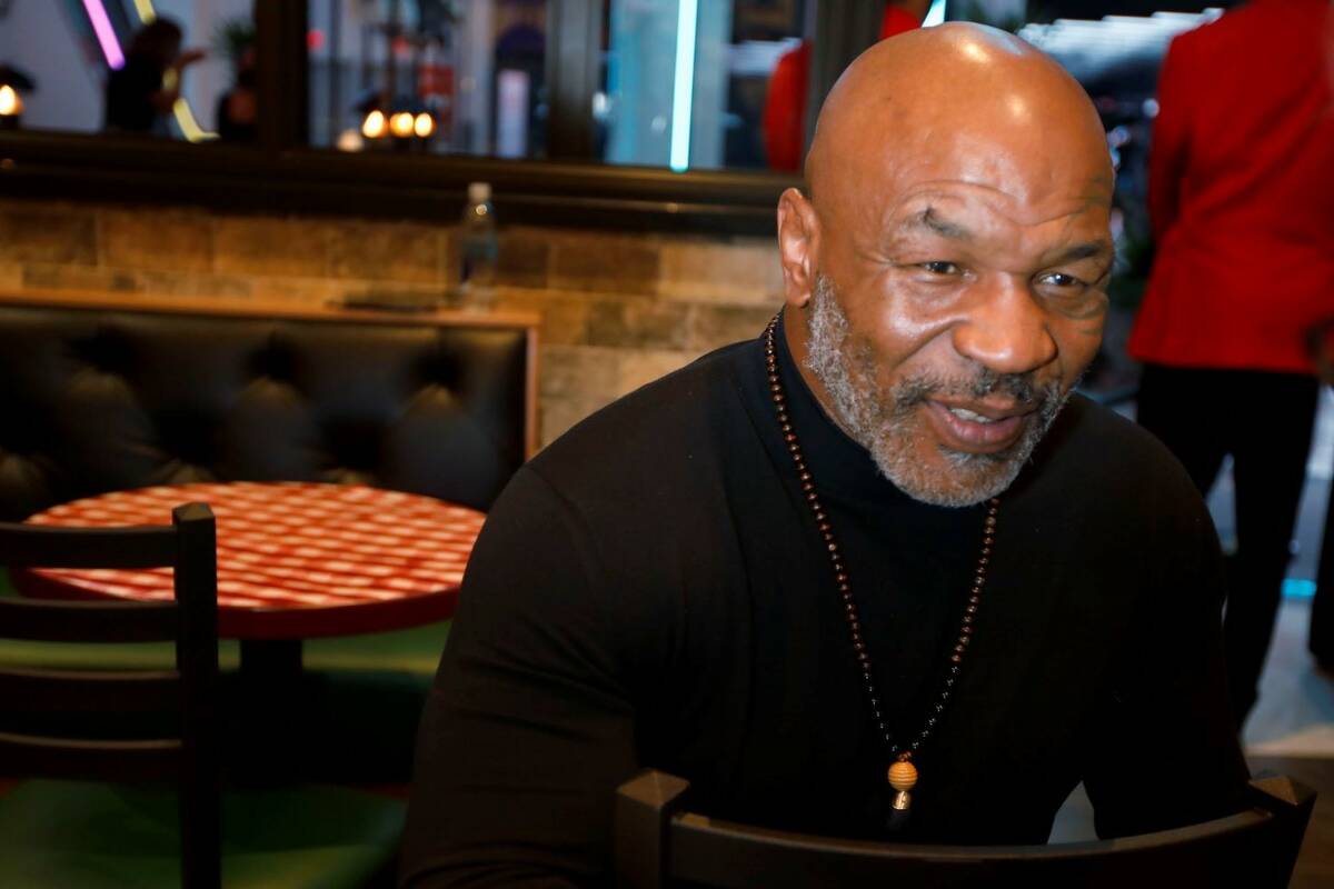 Former boxer Mike Tyson is shown after the unveiling of his statue at Mulberry Street Pizzeria ...