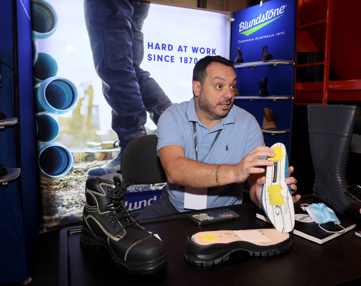 Fernando Nazco of Blundstone USA in Cranbury, N.J. shows his work boots on opening day of the W ...
