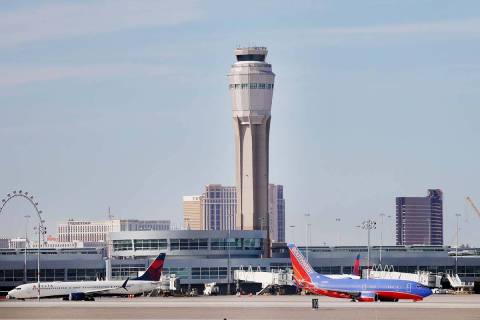 In this Feb. 27, 2020 file photo, planes land and take off at Harry Reid International Airport ...