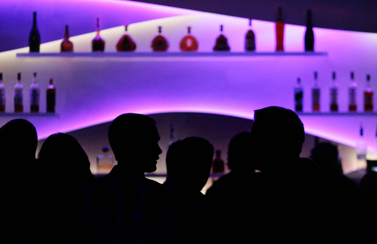 Clubgoers crowd the bar at Ghostbar nightclub at the Palms in Las Vegas. (John Locher/Las Vegas ...