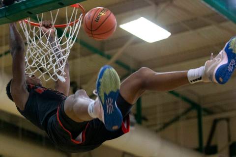 Las Vegas’ Taviontae Jackson (2) dunks against Green Valley during a boys high school basketb ...