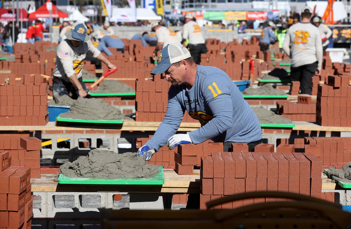 Competitors in the Bricklayer 500 during the World of Concrete construction trade show at the L ...