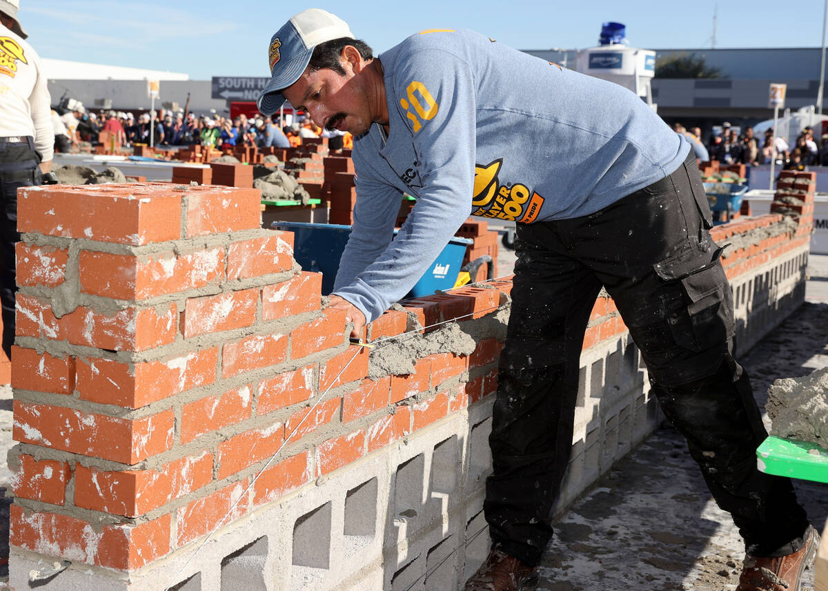 Masons, including Renato Villegas (10) of Telligent Masonry in Rockville, Md., compete in the B ...