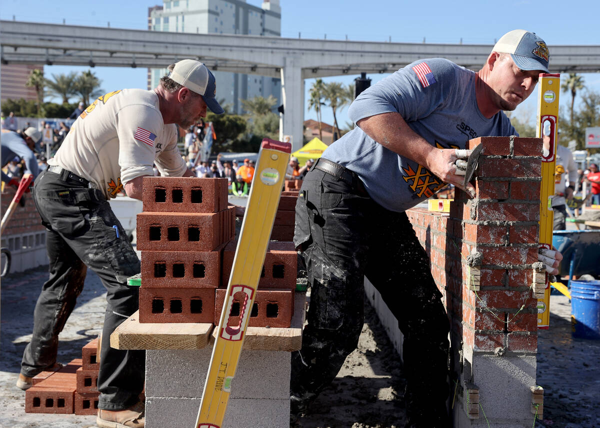 Masons, including JT Payne (13) of Foeste Masonry of Cape Girardeau, Mo., compete in the Brickl ...