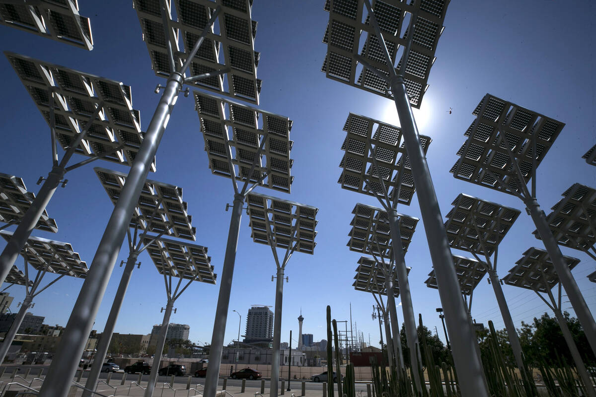 Rows of solar panels soak up the sun's rays outside Las Vegas City Hall in downtown Las Vegas o ...