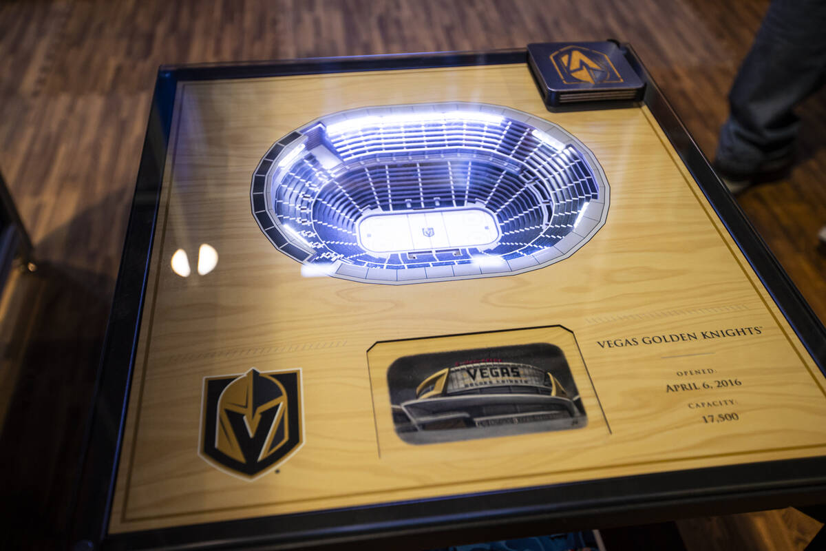A Golden Knights stadium table featuring T-Mobile Arena its seen at the YouTheFan booth during ...