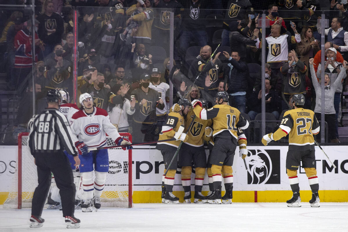 Golden Knights players Reilly Smith (19), center Nicolas Roy (10) and defenseman Shea Theodore ...