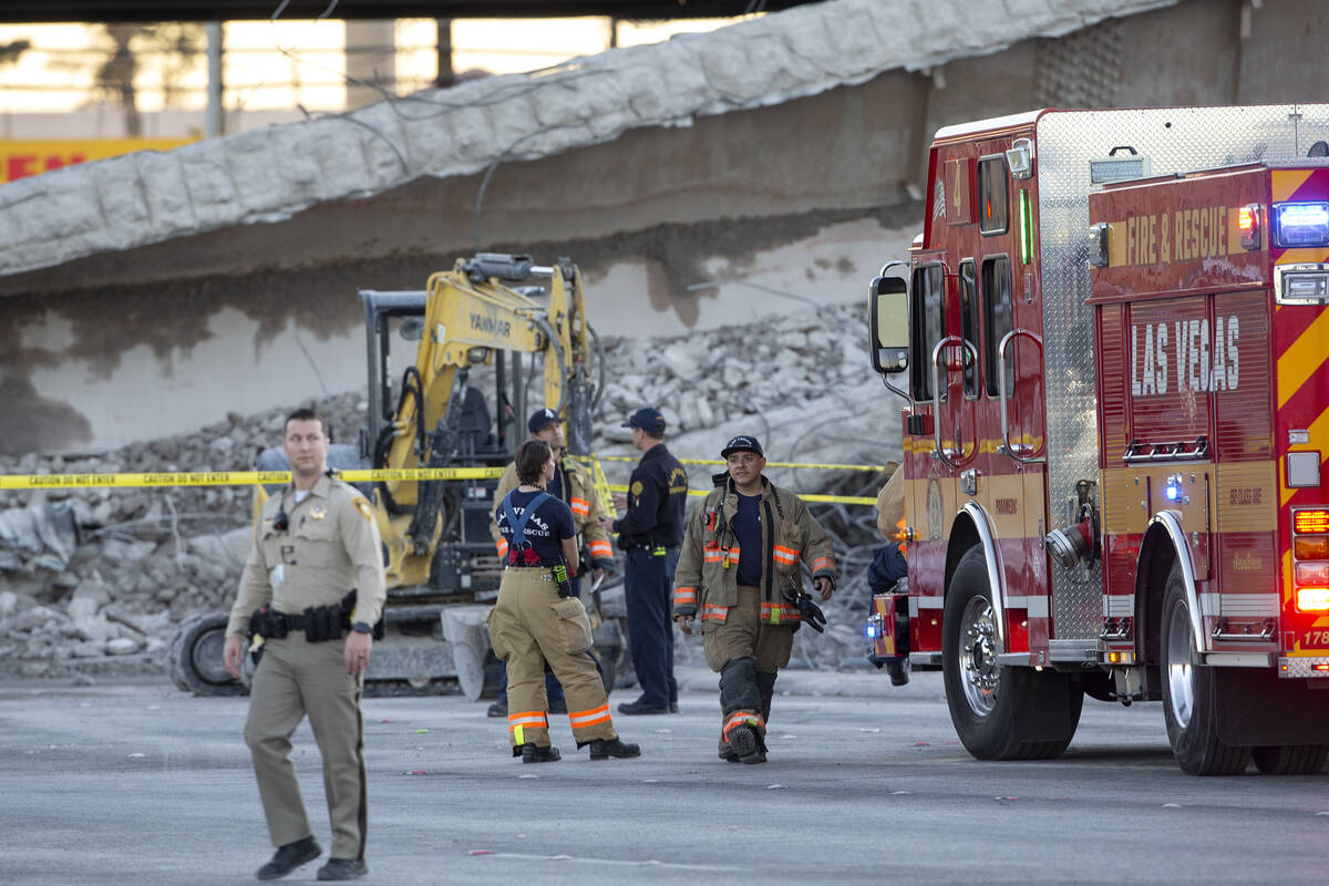 Las Vegas police and Las Vegas Fire and Rescue respond to the scene where a portion of a bridge ...