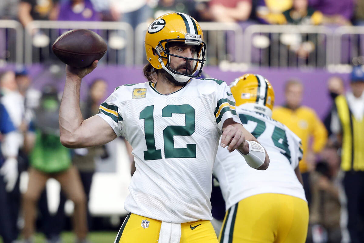 FILE - Green Bay Packers quarterback Aaron Rodgers (12) throws a pass during the first half of ...
