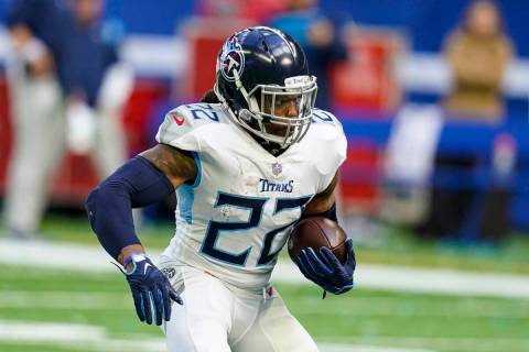 Tennessee Titans running back Derrick Henry runs against the Indianapolis Colts in an NFL footb ...