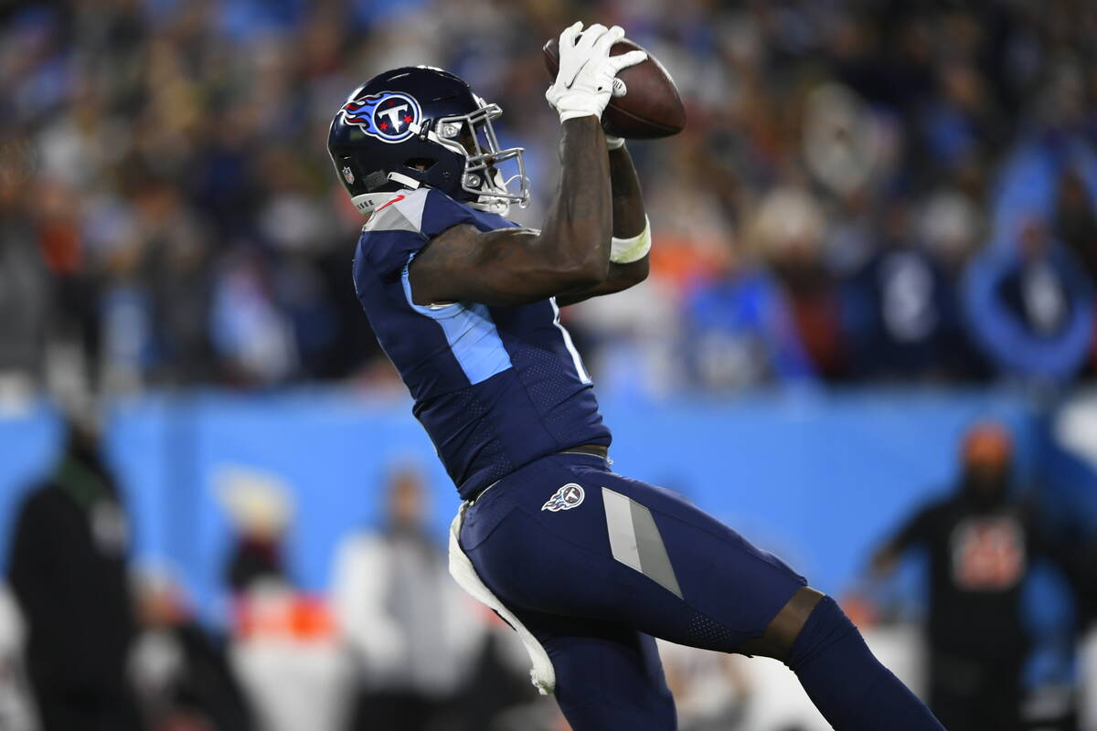 Tennessee Titans wide receiver A.J. Brown (11) makes the catch against the Cincinnati Bengals d ...