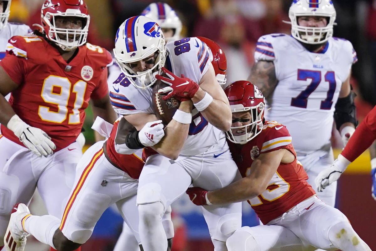 Buffalo Bills tight end Dawson Knox (88) is tackled by Kansas City Chiefs safety Daniel Sorense ...