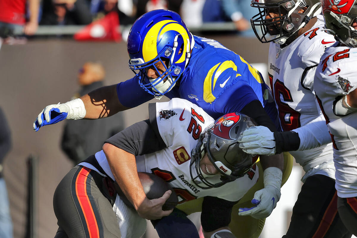 Los Angeles Rams defensive end Aaron Donald (99) sacks Tampa Bay Buccaneers quarterback Tom Bra ...