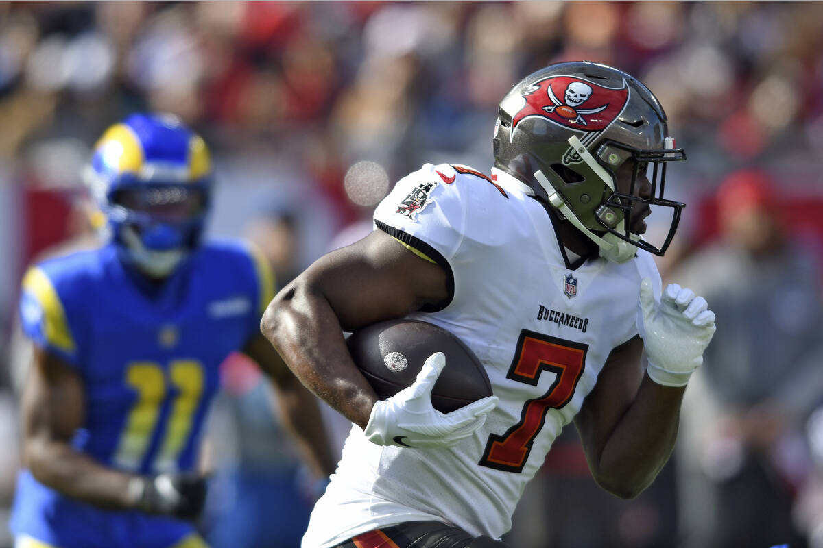 Tampa Bay Buccaneers' Leonard Fournette runs against the Los Angeles Rams during the first half ...