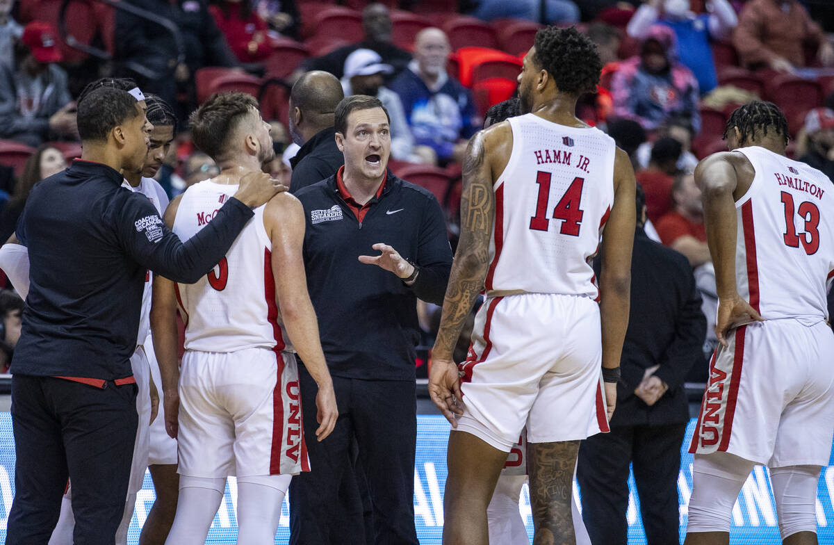 UNLV Rebels head coach Kevin Kruger instructs his players in a timeout late versus San Jose Sta ...