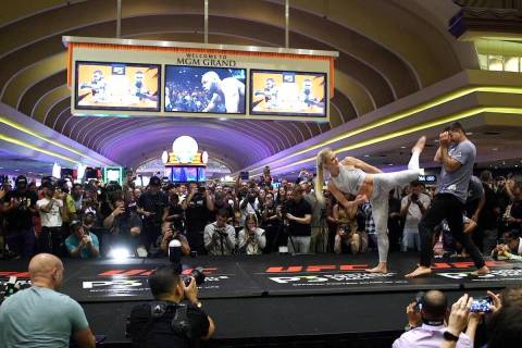 UFC bantamweight contender Holly Holm throws a kick at the open workouts at the MGM Grand hotel ...