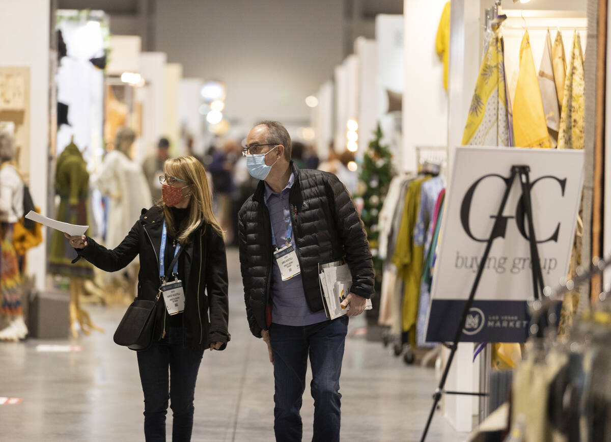 Marcey, left, and James Nuccitelli walk the event halls during the Las Vegas Market at World Ma ...