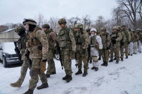 Members of Ukraine's Territorial Defense Forces, volunteer military units of the Armed Forces, ...