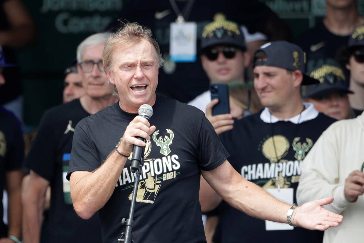 Milwaukee Bucks co-owner Wes Edens speaks to the crowd during a parade celebrating the Milwauke ...