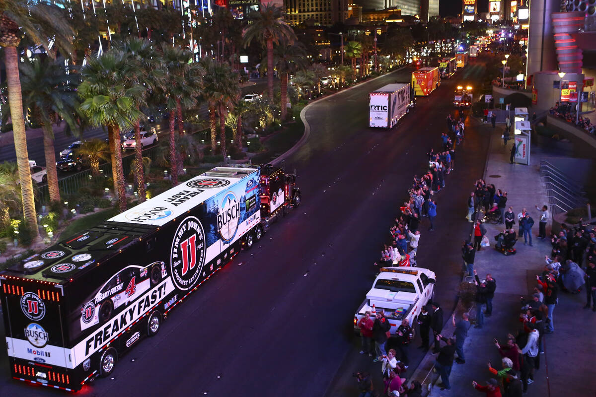 The hauler of Kevin Harvick (4) parades down the Las Vegas Strip near Harmon Road ahead of the ...