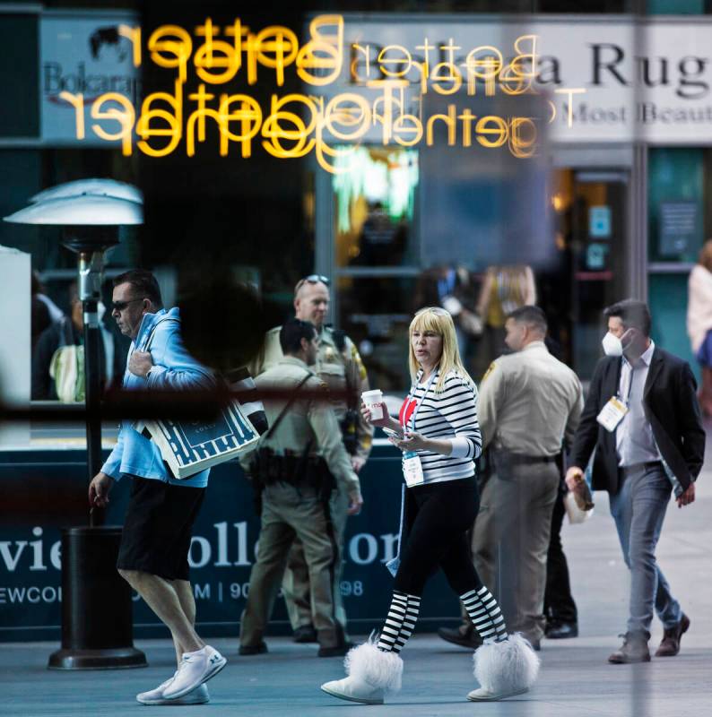 Conventiongoers walk in the courtyard during the Las Vegas Market at World Market Center Las Ve ...