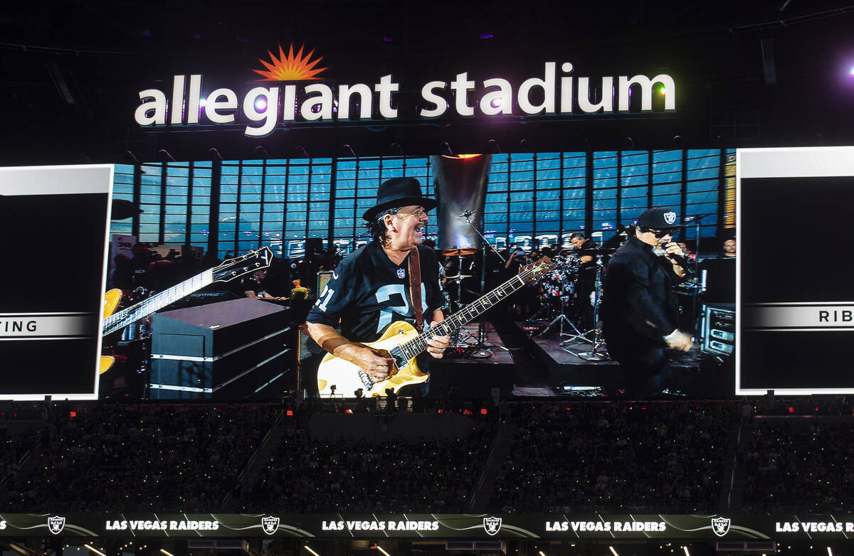 Musician and Las Vegas resident Carlos Santana performs at halftime during an NFL preseason foo ...