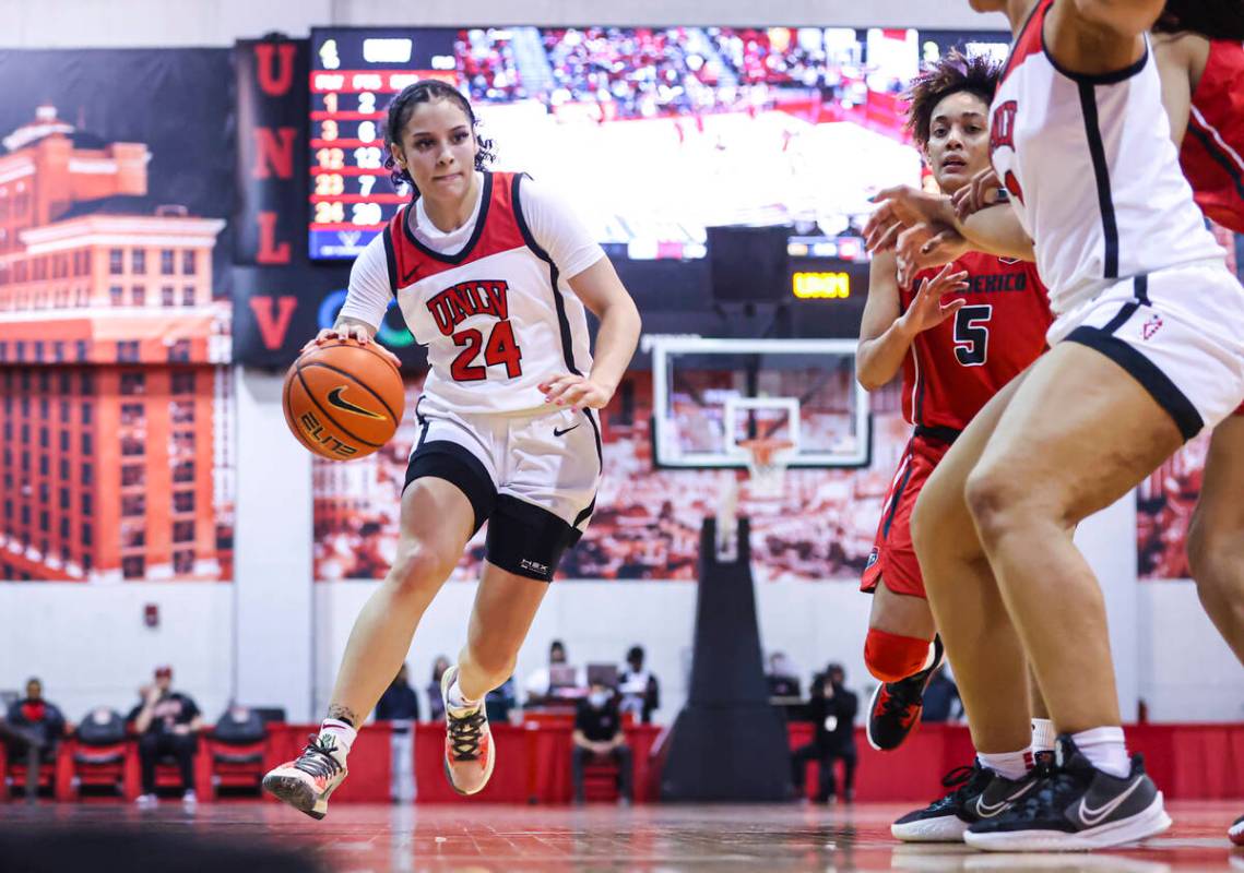 UNLV Lady Rebels guard Essence Booker (24) drives to the basket against the New Mexico Lobos du ...