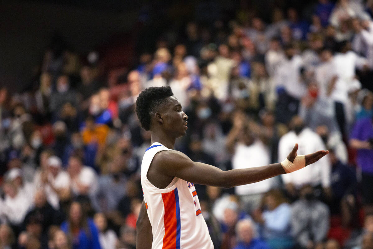 Bishop Gorman’s Chris Nwuli (23) celebrates after dunking against Liberty during the fir ...